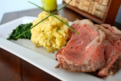 Awesome roast beef and mashed potatoes on a white plate.