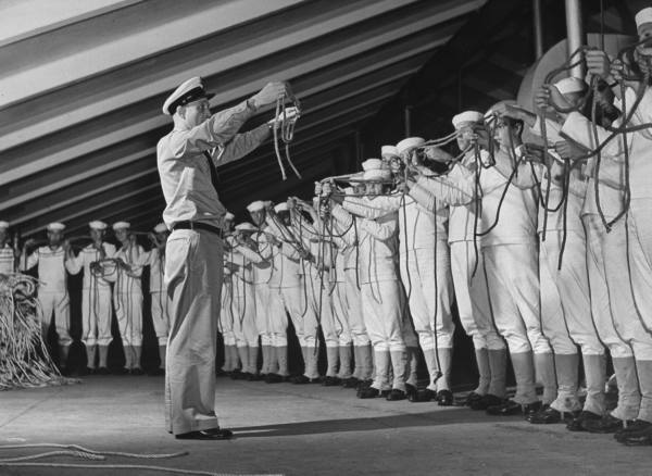 A group of men standing in a line.